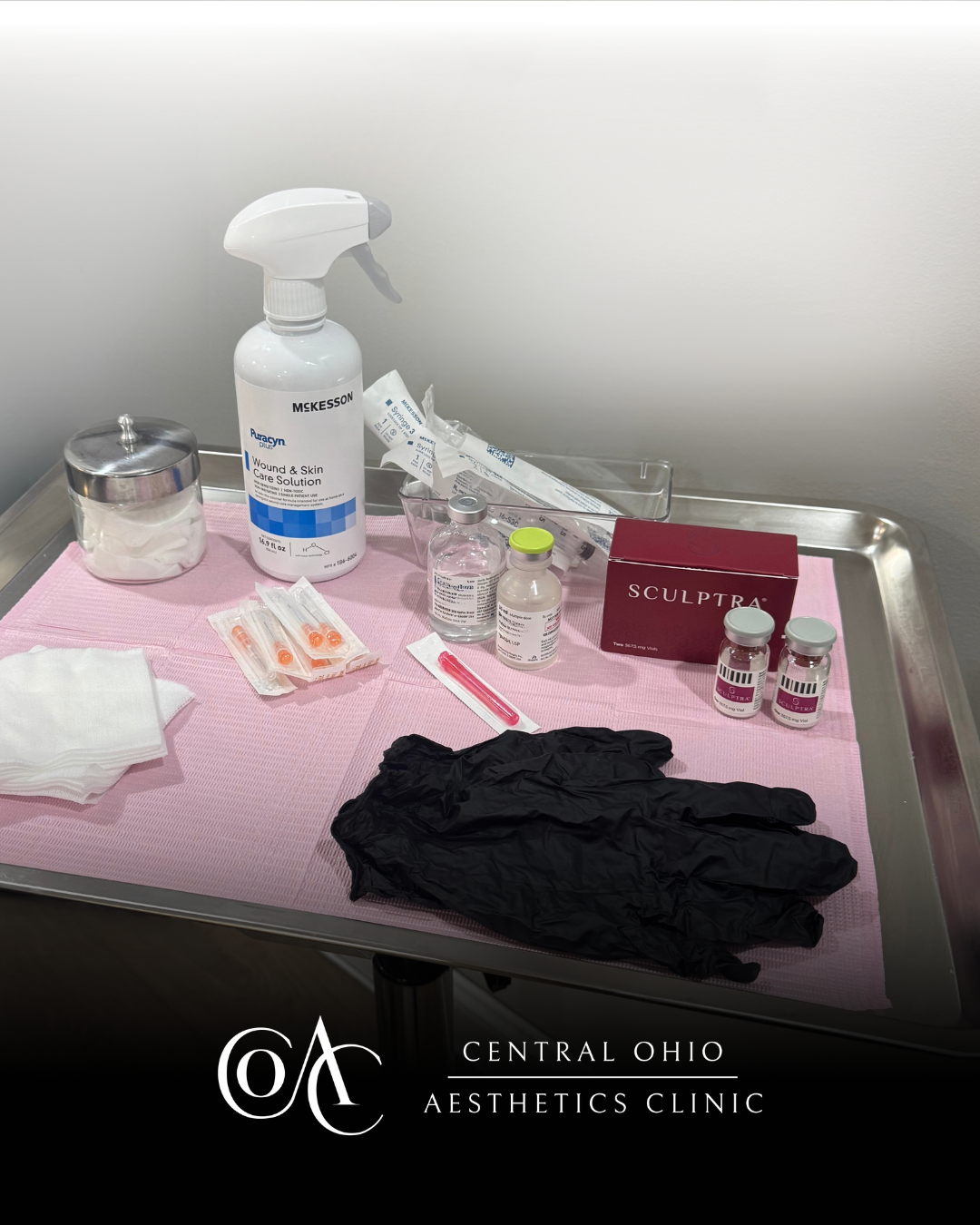 A tray displaying various gloves and additional items arranged neatly on its surface.